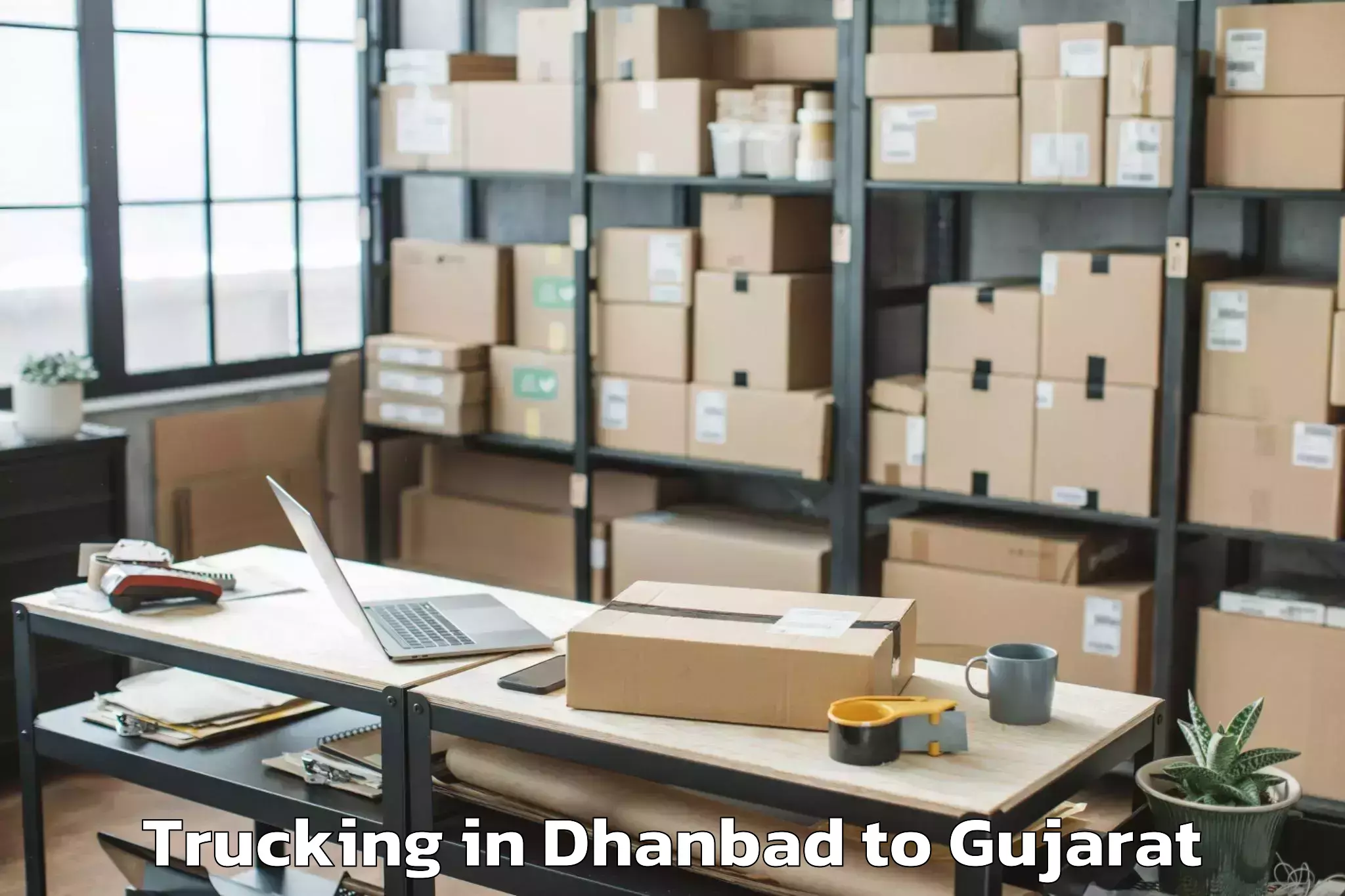 Hassle-Free Dhanbad to Junagadh Agricultural Universi Trucking